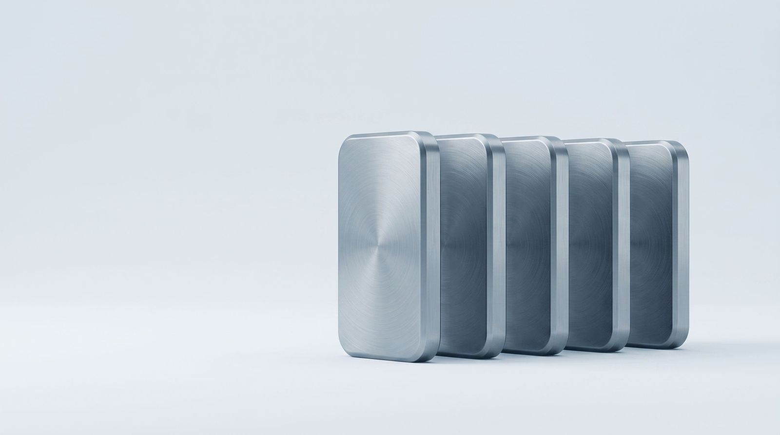 Five identical steel forms standing in an evenly spaced, aligned row